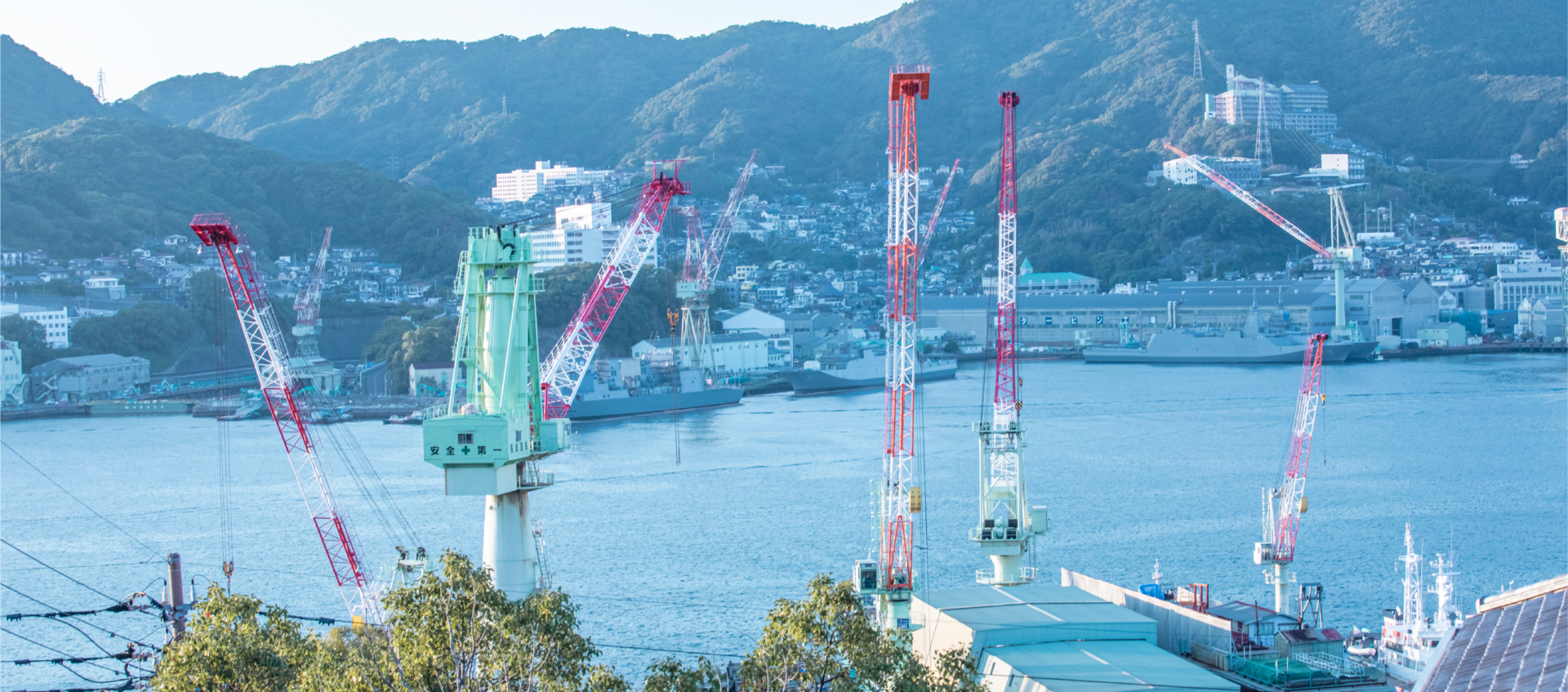 From the top of the hill, the sound of ship horns echoes across Nagasaki's harbour.